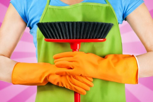 Professional cleaners handling desks and shared office surfaces in Brompton