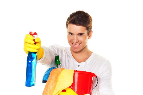 Technician using safe cleaning practices during a carpet cleaning job